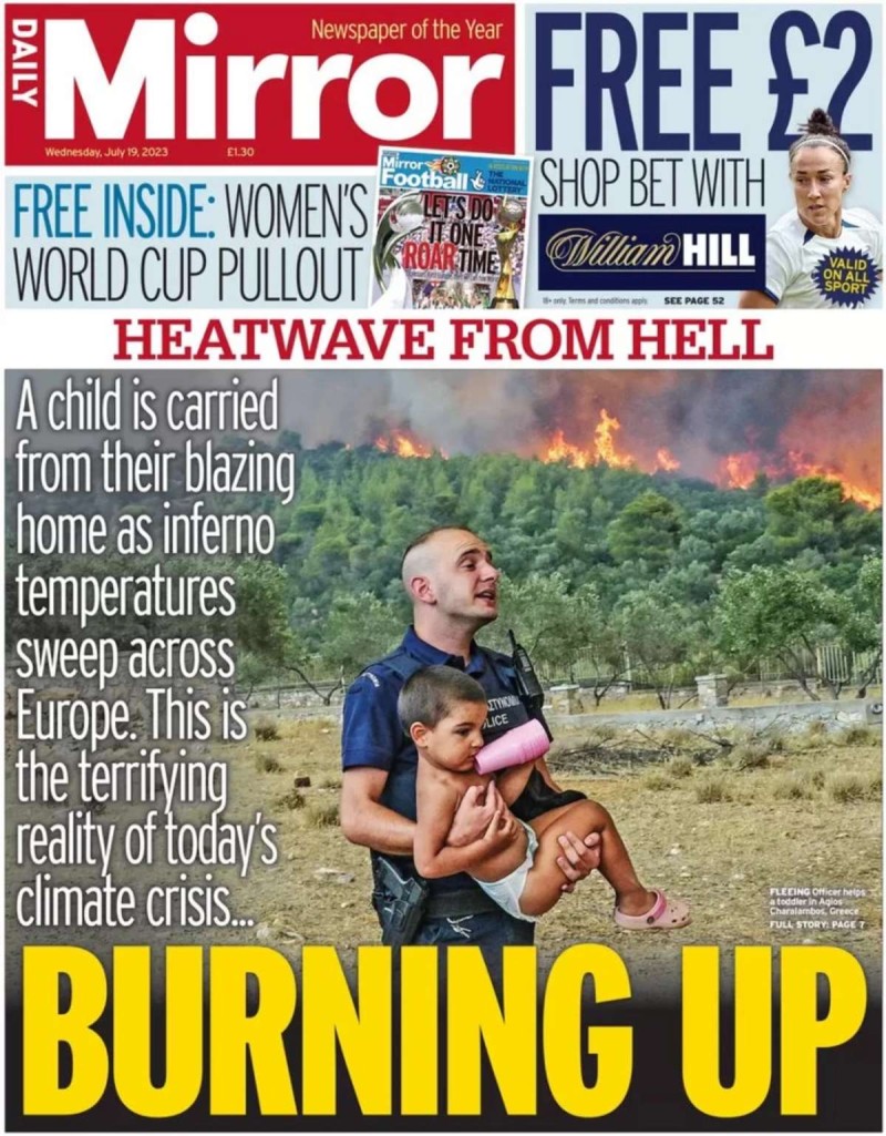 Αστυνομικός μεταφέρει παιδί στην φωτιά στα Δερβενοχώρια