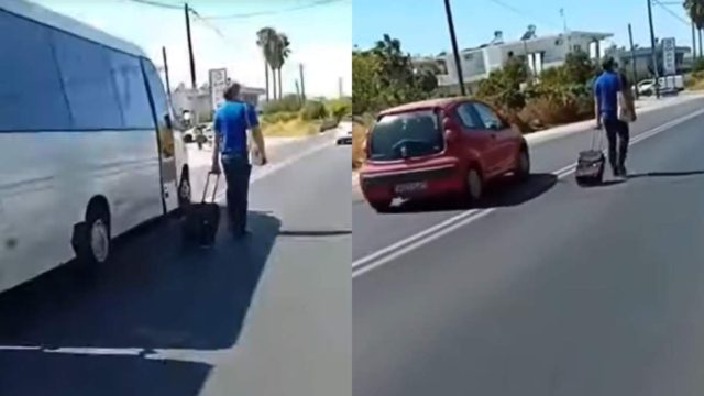 Προκάλεσε κυκλοφοριακό κομφούζιο: Τύπος σέρνει βαλίτσα με ροδάκια στη μέση του δρόμου και τα αυτοκίνητα αναγκάζονται να τον προσπεράσουν! (video)