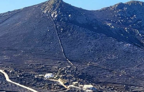 a mountain with a house on it
