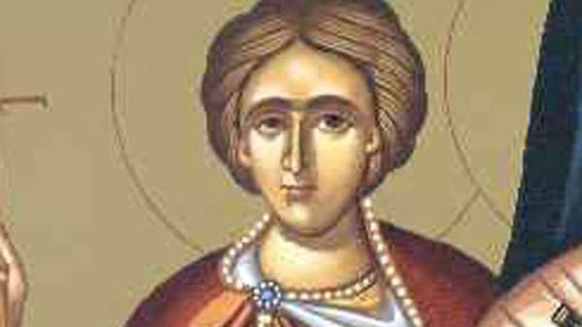 Αγιογραφία του Αγίου Ησυχίου σε χρυσό φόντο, κρατώντας έναν σταυρό που συμβολίζει το μαρτύριο